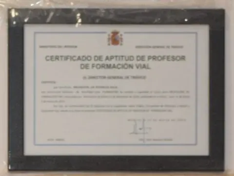 The framed Certificado de Aptitud de Profesor de Formación Vial, headed Ministerio del Interior and Dirección General de Tráfico, with the Spanish coat of arms.